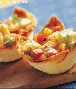Crispy Bread Cups are cups filled with sweet corn, tomatoes and a mix of vegetables.