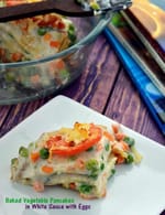 Baked Vegetable Pancakes in White Sauce with Eggs