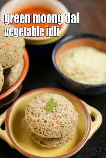 Green moong dal vegetable idli stacked in a yellow ceramic bowl, garnished with coriander, served with coconut chutney and red chutney in small bowls.