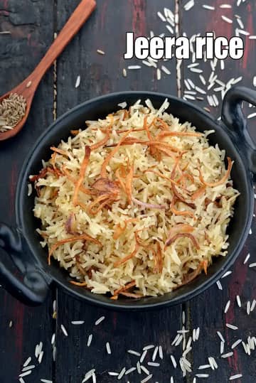 Fluffy Jeera Rice garnished with fried onions, served in a black handi.