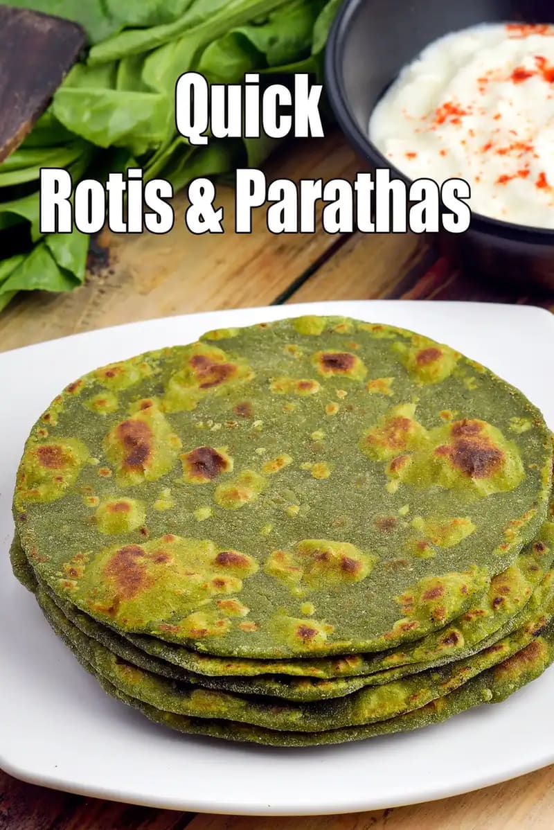 Stack of quick green rotis or parathas served on a white plate, made with leafy greens, lightly roasted, and shown with curd and fresh greens in the background.