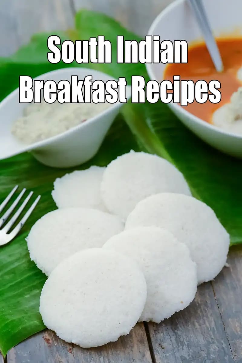 Soft South Indian idlis arranged on a green banana leaf, served with coconut chutney and sambar in white bowls, with the text “South Indian Breakfast Recipes” displayed on the image.