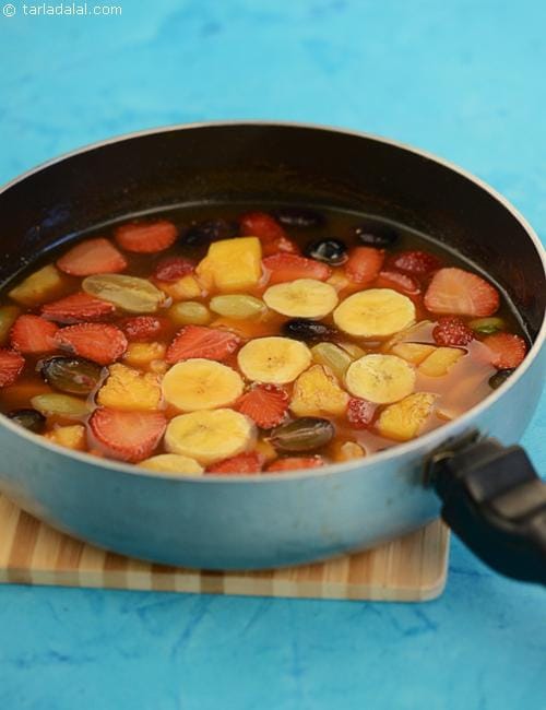 Grapes, Strawberries, Bananas and Pineapple in Orange Sauce recipe | Tarla Dalal