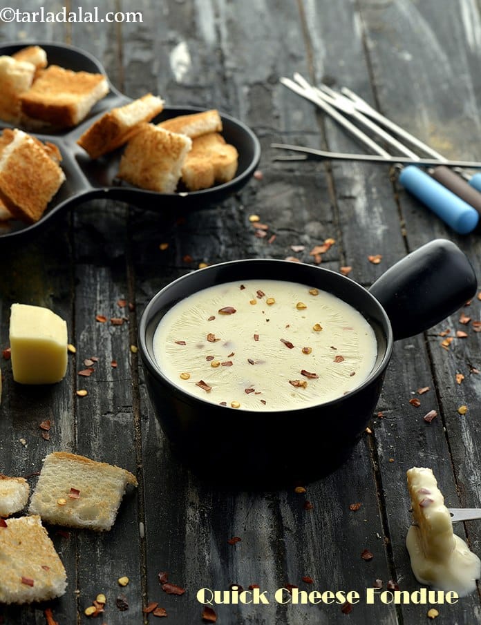 Quick cheese fondue recipe | classic Indian cheese fondue | easy cheese fondue | cheese fondue with cheese spread | | Tarla Dalal