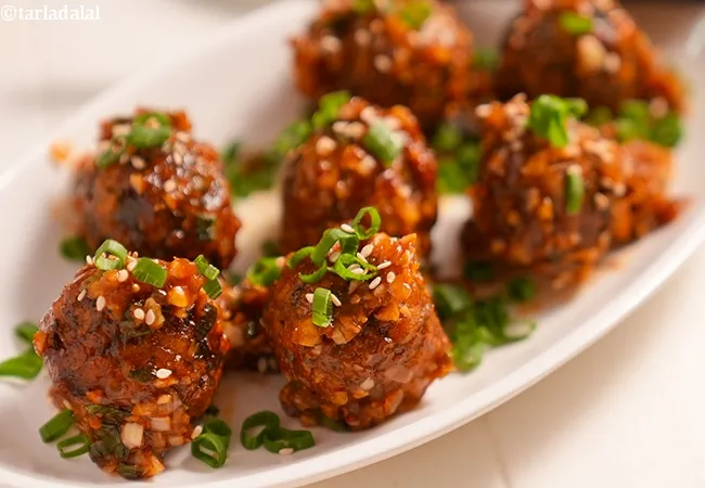 manchurian balls in hot garlic sauce recipe | Chinese style vegetable balls in spicy hot garlic sauce | manchurian in hot and spicy sauce