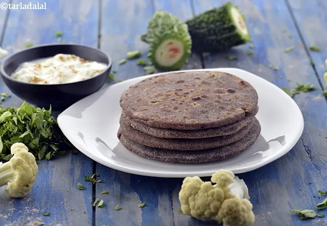 stuffed nachni roti | stuffed nachni roti with cauliflower, karela, methi | healthy ragi paratha |